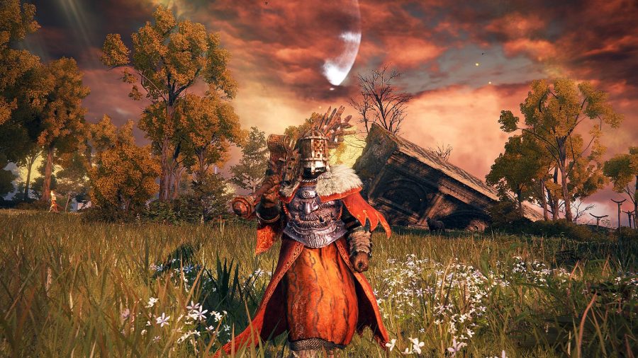 Elden Ring dying twice: the player striding towards the camera wearing a full set of red-tinted armour and holding a ultra greatsword
