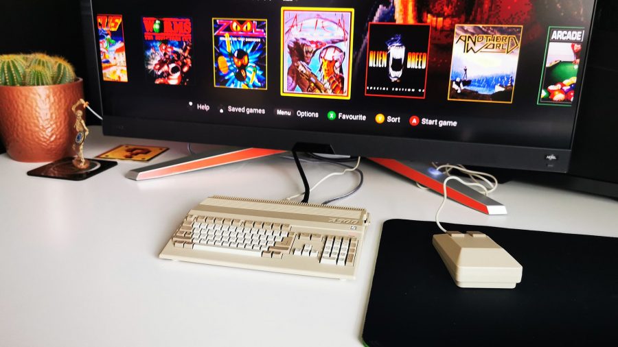 A500 Mini retro gaming PC Amiga setup on desk with game thumbnails on screen