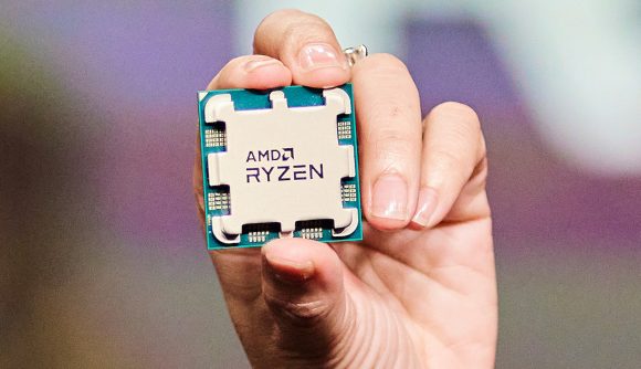 Hand holding AMD Ryzen CPU