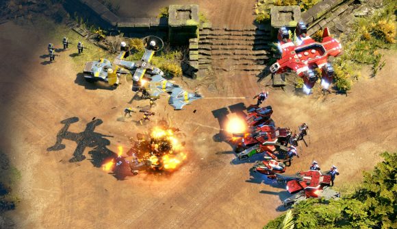 Yellow-accented aircraft bombard red team units on a wide dirt road in RTS game Crossfire: Legion