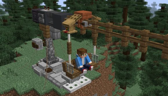 A character sits in the chair of a Minecraft zipline
