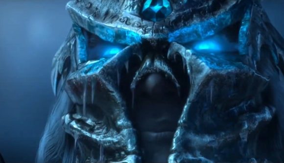 The Lich King's eyes glow blue from under his frozen iron helmet in the cinematic trailer for World of Warcraft's Wrath of the Lich King Classic expansion.