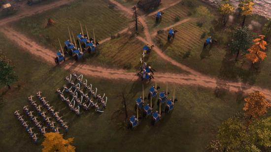 Rus troops in blue gather by the riverside in Age of Empires IV