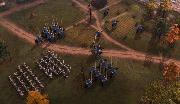 Rus troops in blue gather by the riverside in Age of Empires IV