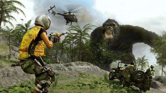 A soldier, a helicopter, and a jeep full of fighters aim their weapons at King Kong as he approaches from a forest of palm trees in Call of Duty: Warzone, whose QA studio has voted to form an employee union.