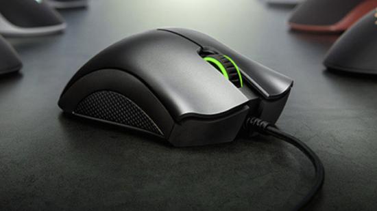 Razer Deathadder gaming mouse sitting on grey surface