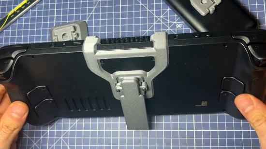 Steam Deck mod with 3D printed kickstand attachment on back of handheld