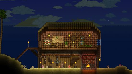Minecraft modder hired to work on Terraria: A two-storey beach house looks warm and cozy at night in Terraria