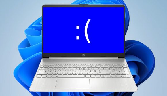 Laptop with sad text face and Windows 11 artwork in backdrop