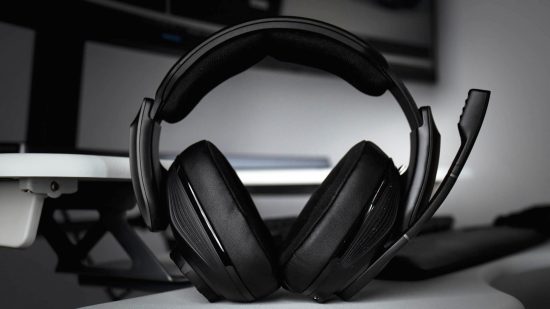 The most sturdy gaming headset - the Sennheiser GSP 670 - is seen here standing upright against a keyboard