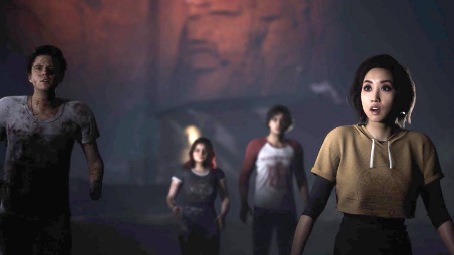 The Quarry cast and characters: several camp counsellors are walking through a cave.