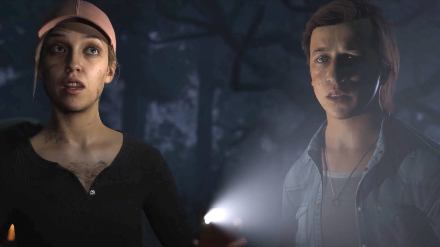 The Quarry cast and characters: Laura and Max are a bit freaked out having seen something in the woods.  Laura is holding a flashlight.