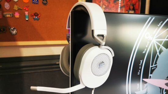 The Corsair HS65 gaming headset has the best headset mic, seen here hanging on the corner of a gaming monitor