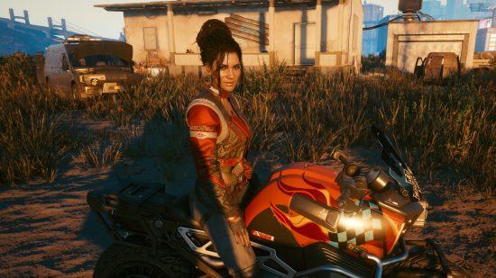 Cyberpunk 2077 AMD FSR 2.0 mod: Panam sits astride a motorcycle in the Badlands as the sun sets outside Night City