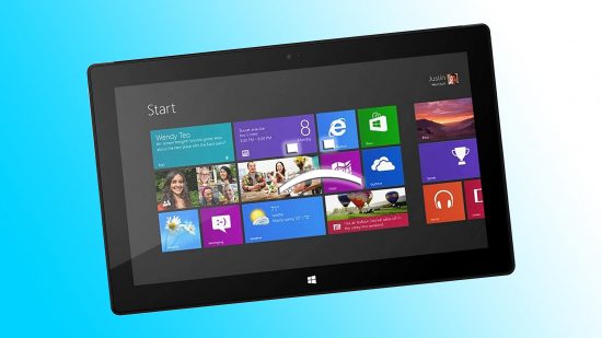 Microsoft tablet with Windows 8 tiles on blue backdrop