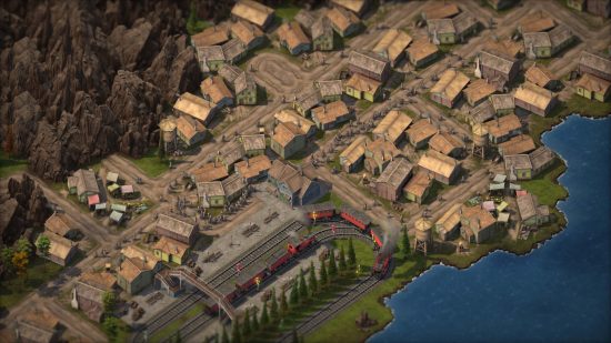 Sweet Transit demo: An overhead view of a village by a lake as a red train pulls in from the southwest