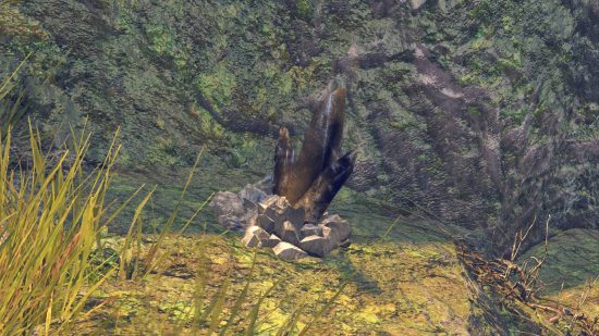 Monster Hunter Rise Sunbreak Awegite: a black mineral vein that's next to a cliff wall.