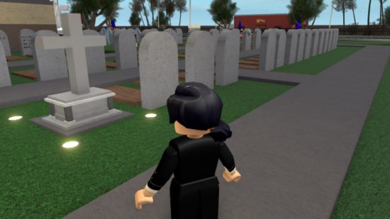 A Roblox avatar in all black stands in front of sever gravestones.