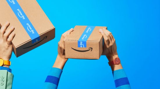 Hands holding up Amazon Prime package on blue backdrop
