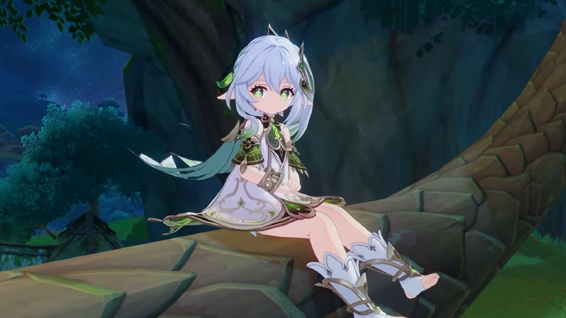 Upcoming Genshin Impact character Nahida sits in a tree with a shy look