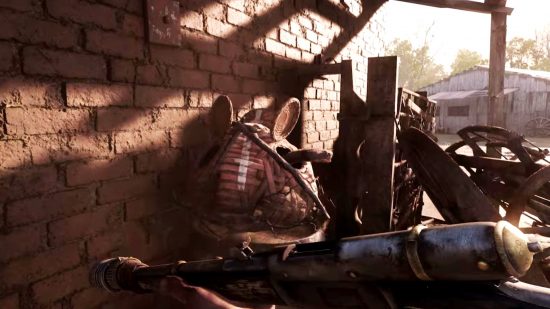 Hunt: Showdown Serpent Moon battle pass: A venomous snake pokes its head out of a wicker basket resting on a pile of junk next to a brick wall.