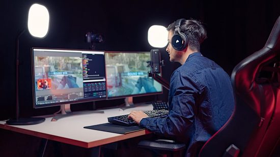 Someone sat at a desk, using an Elgato microphone and Corsair headset, both of which are now able to use Nvidia Broadcast
