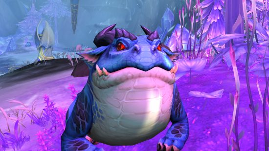 World of Warcraft Dragonflight system requirements: purple dragon with horns on purple landscape