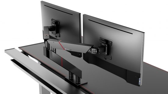 The Secretlab Magnus Pro XL gaming desk has Secretlab's new monitor arms clamped, attached to two displays