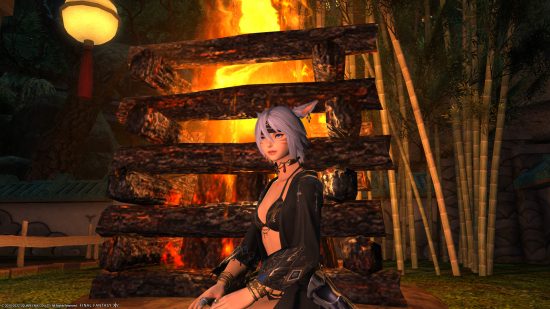 FFXIV Moonfire Faire 2022: A character sat in front of a fire wearing some of the rewards from the event
