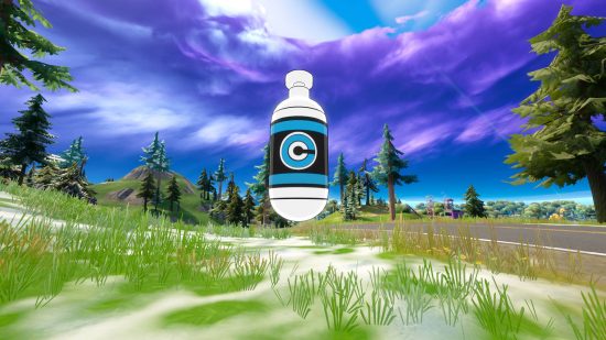 Fortnite Kamehameha: a Capsule Corp capsule on the melting snow. It is a white bottle with a black label with blue bands and a stylised letter C.