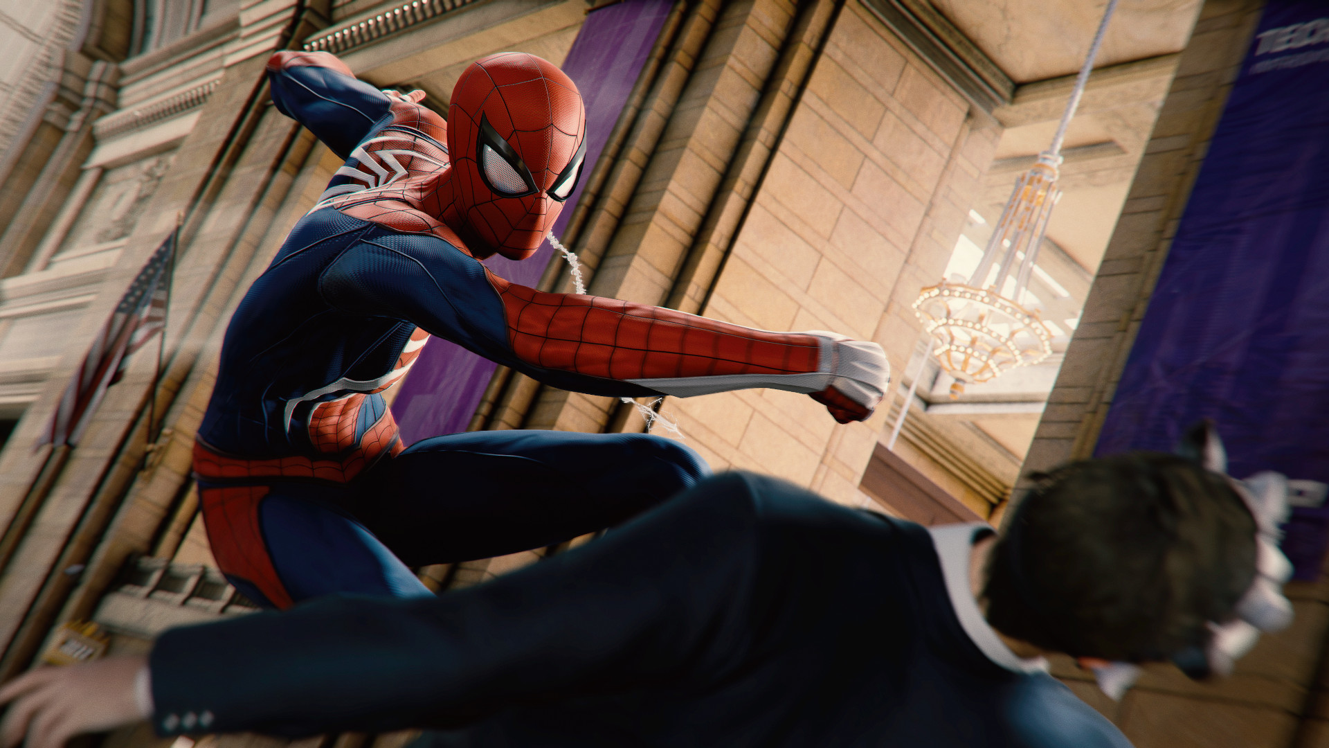 Marvel's Spider-Man Remastered PC review: A goon receives a punch from the web slinger himself