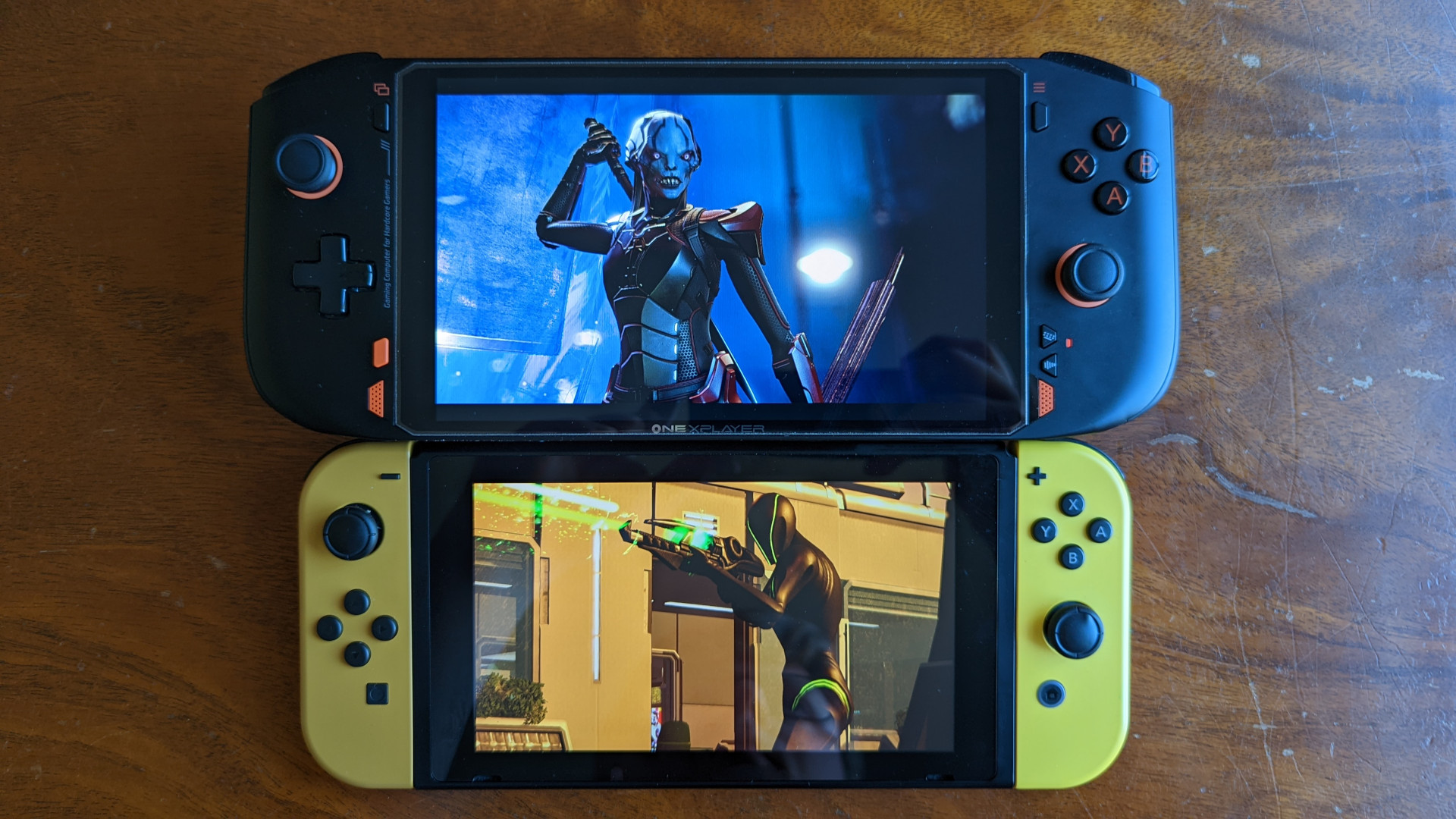 OneXPlayer Mini AMD review: A size comparison between the handheld PC (top) and the Nintendo Switch (bottom)