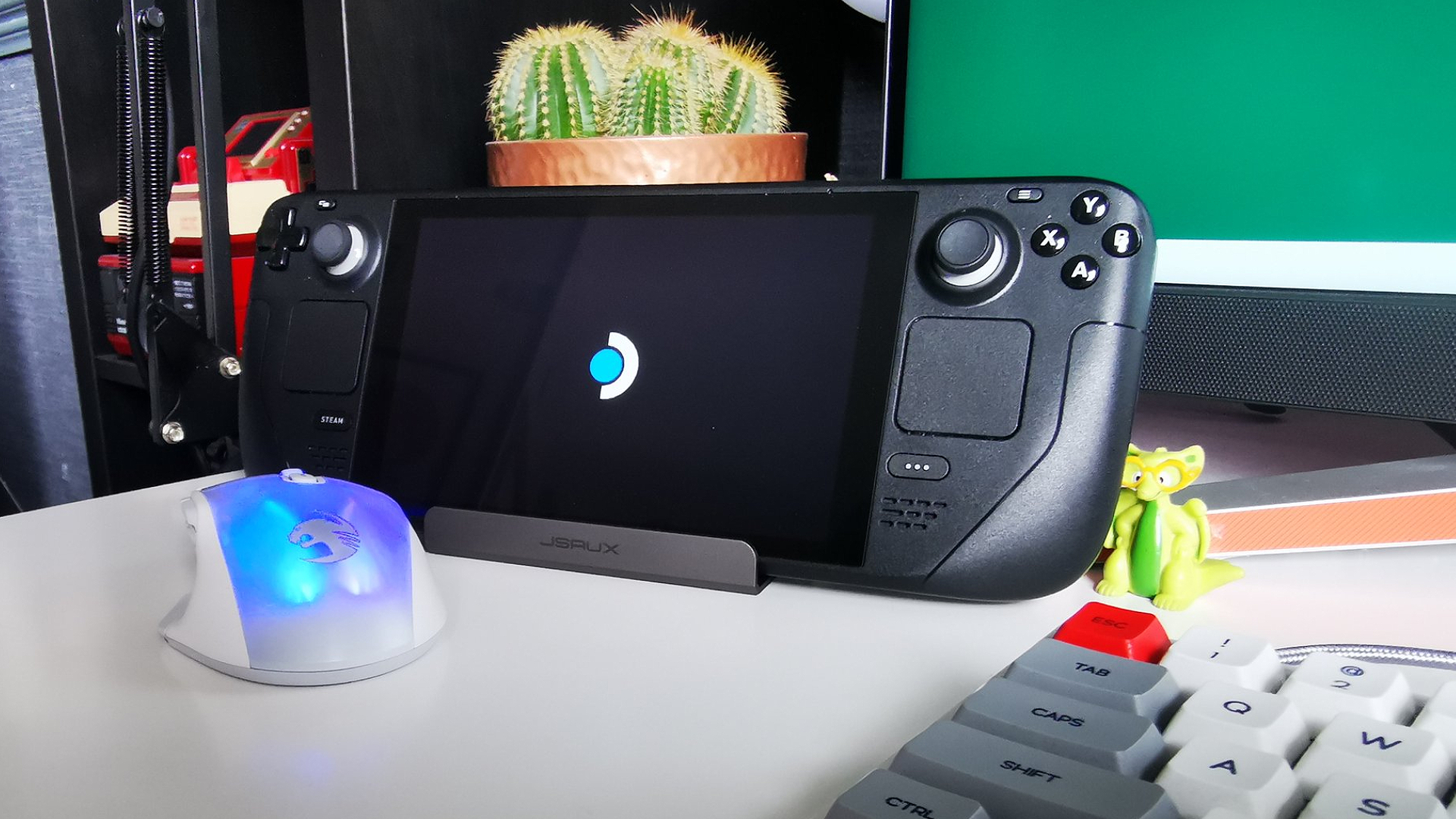 Roccat Kone XP Air gaming mouse next to Steam Deck and dock