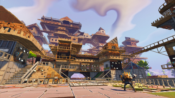A huge wooden fort with multiple floors and rooms rising into the sky.