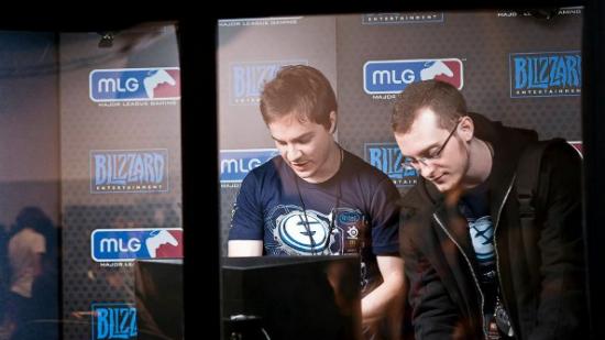 Two Evil Geniuses progamers in a booth at the 2012 BWC tournament.