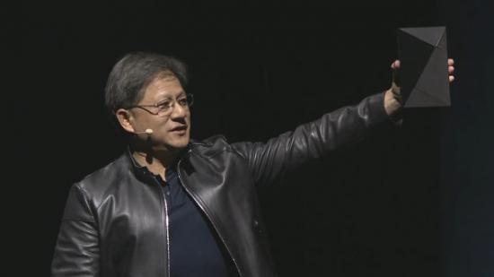 Nvidia President Huang raises the high-tech looking Nvidia Shield.