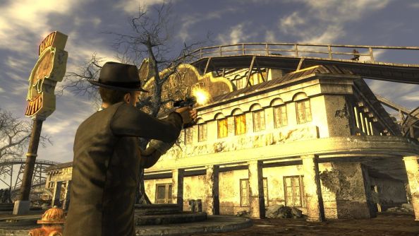 A human character wearing a full black suit firing at an enemy on a roof.